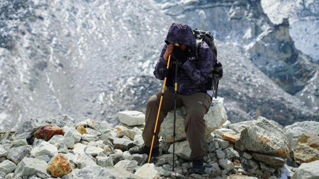 Trekker resting during trek